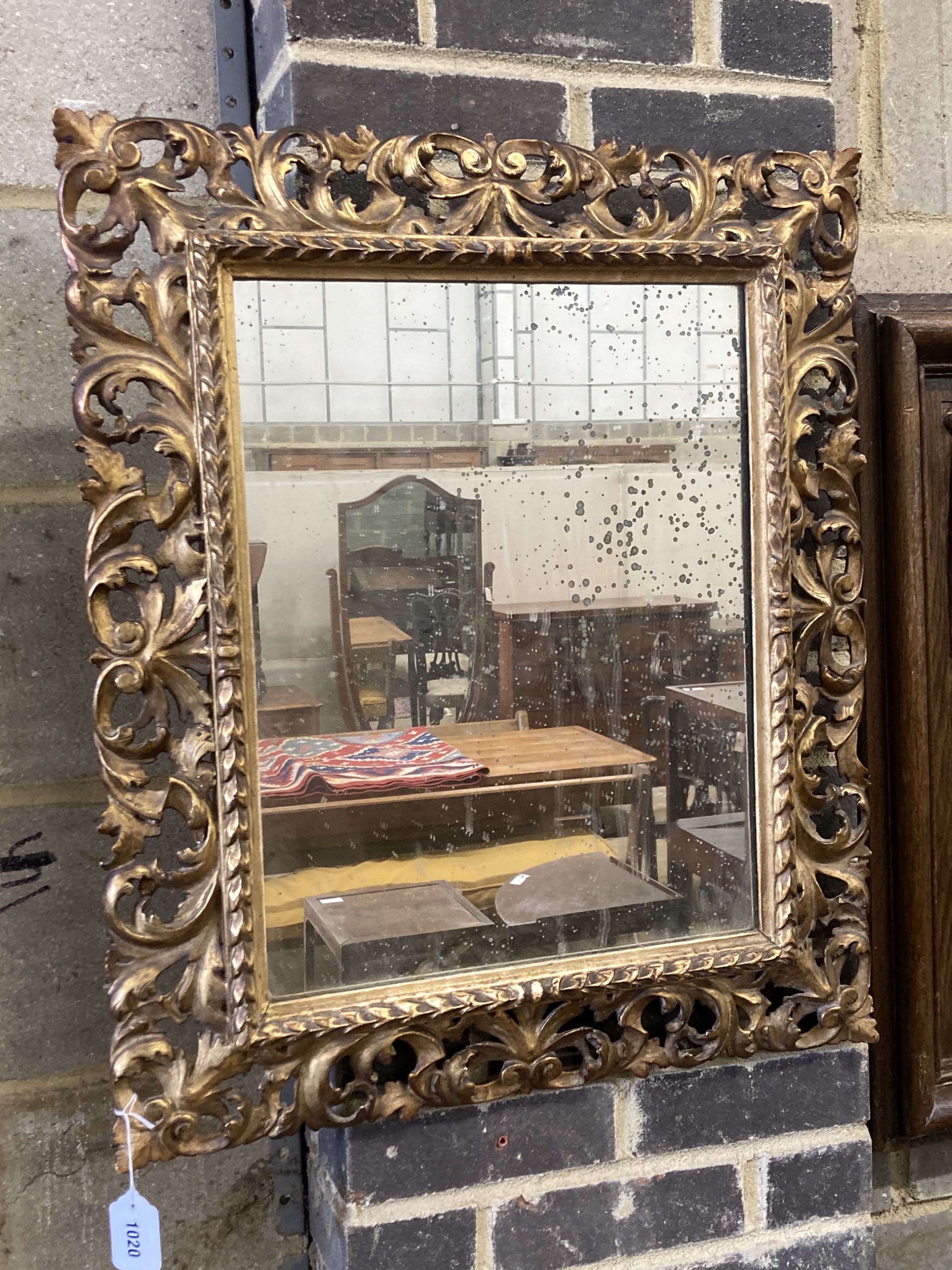 A 19th century Florentine style carved giltwood wall mirror, width 60cm, height 70cm